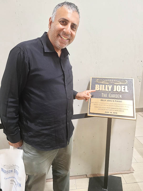 Dr Abbey with Plaque of Billy Joel Piano Man most performance & sold out at MSG