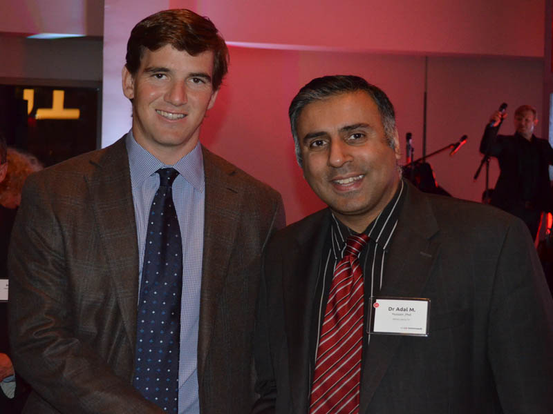 Dr.Abbey with Giants Quaterback Eli Manning